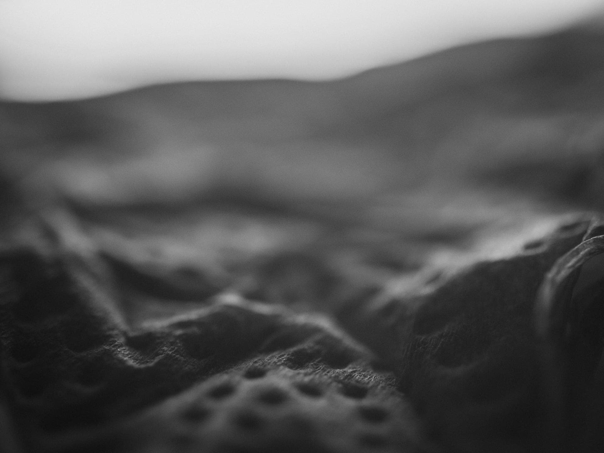 A folded bralette on a plain surface.